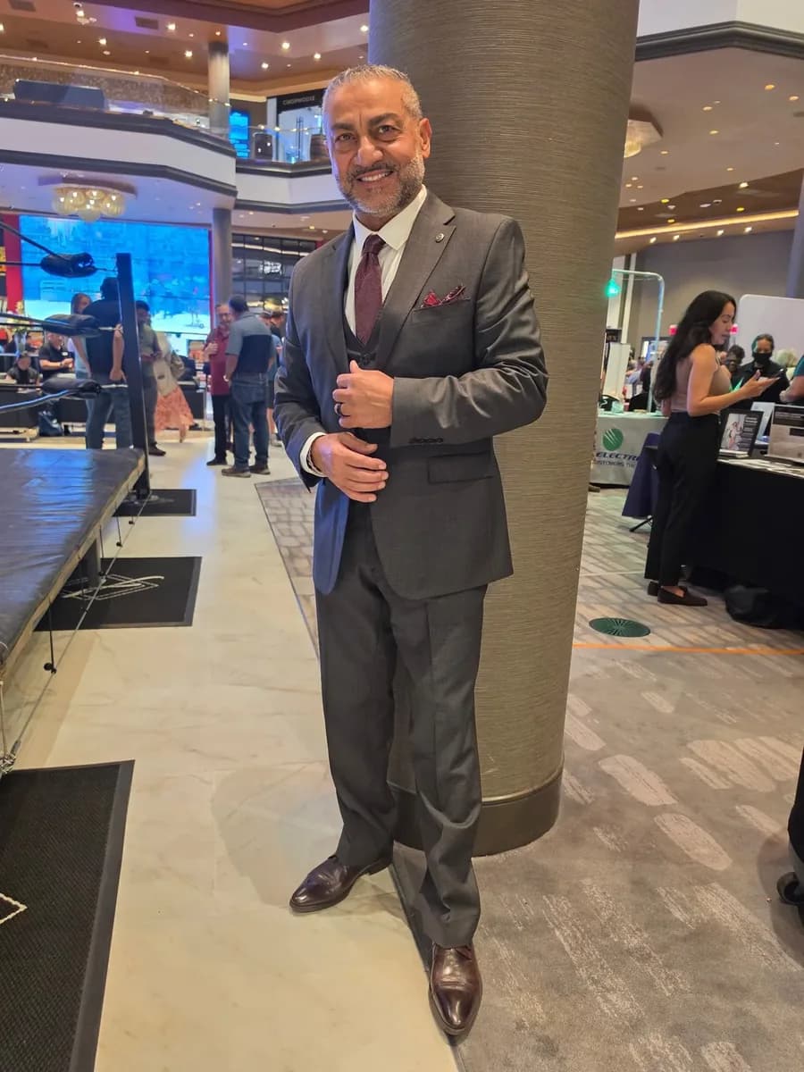 A Jacobi's client in a charcoal three-piece suit and burgundy tie