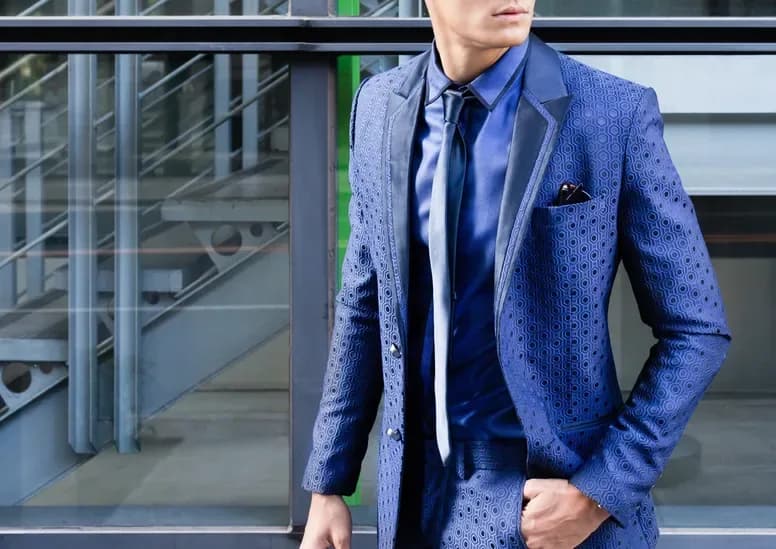 Detail of a textured blue suit jacket
