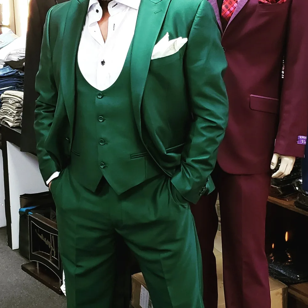 Emerald green and burgundy three-piece suits in the store