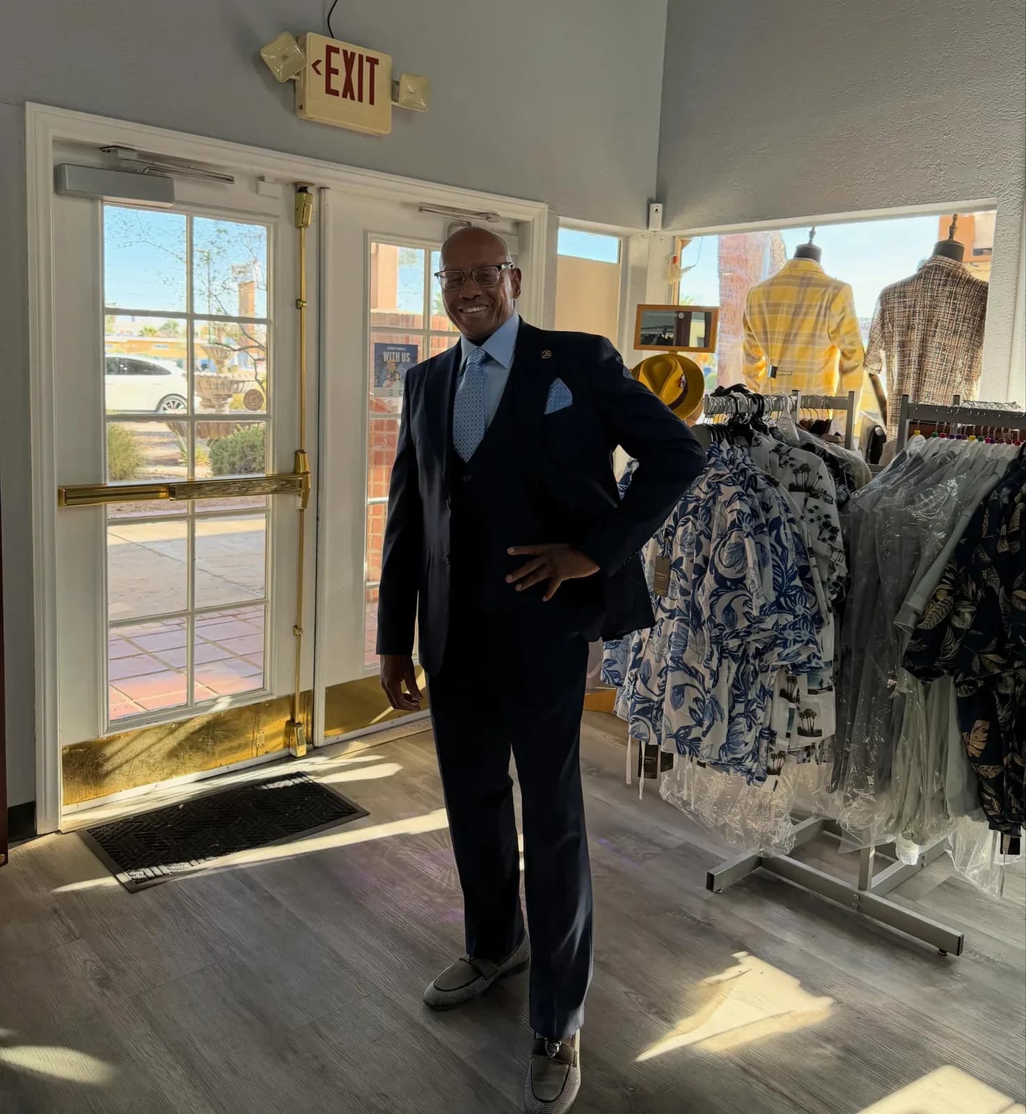 Customer in a navy three-piece suit inside the Jacobi's store